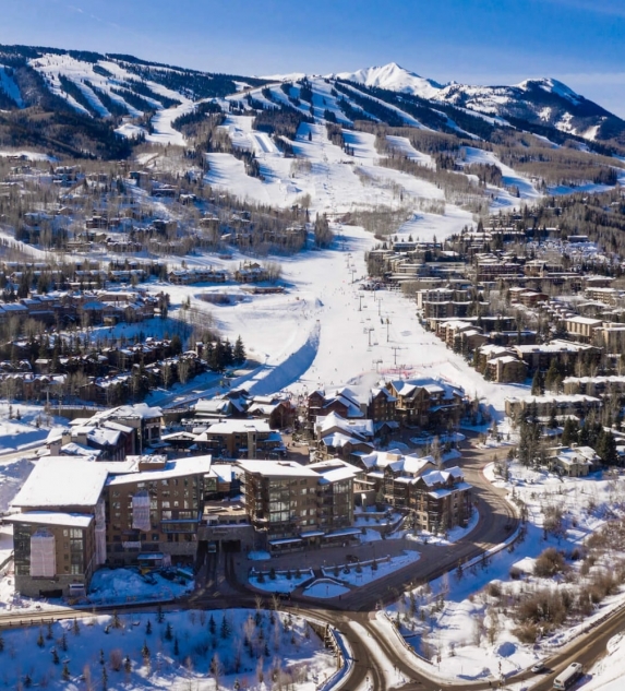 An aerial view of a ski town during winter