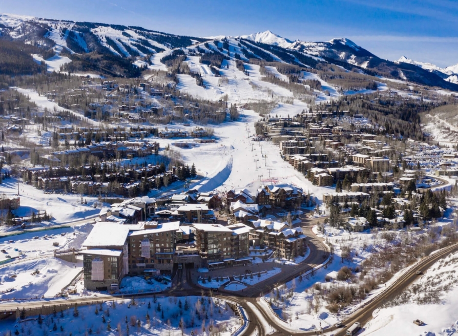 An aerial view of a ski town during winter