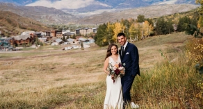 Bride and groom on hillside