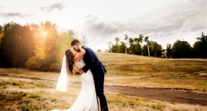 Bride and groom photo in field