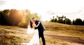 Bride and groom photo in field