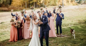 Bride and groom celebrating with bridal party