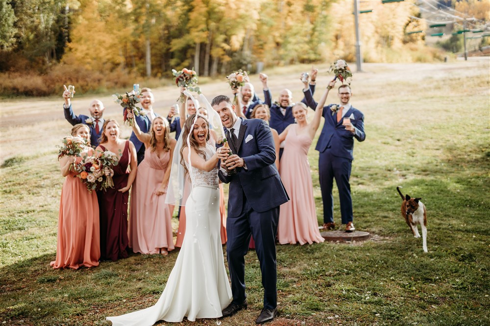 Bride and groom celebrating with bridal party