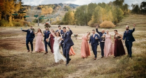 Bride and groom celebrating with bridal party