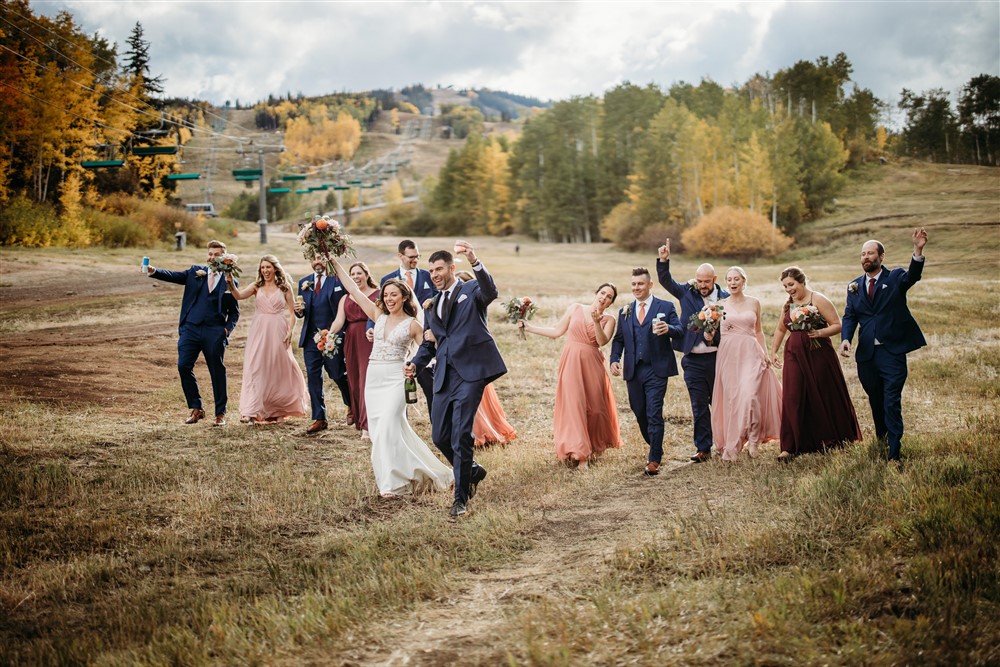 Bride and groom celebrating with bridal party