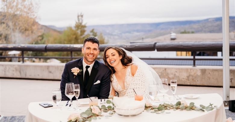 Bride and groom at dinner table