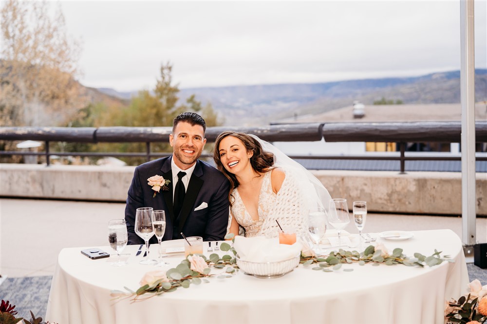 Bride and groom at dinner table