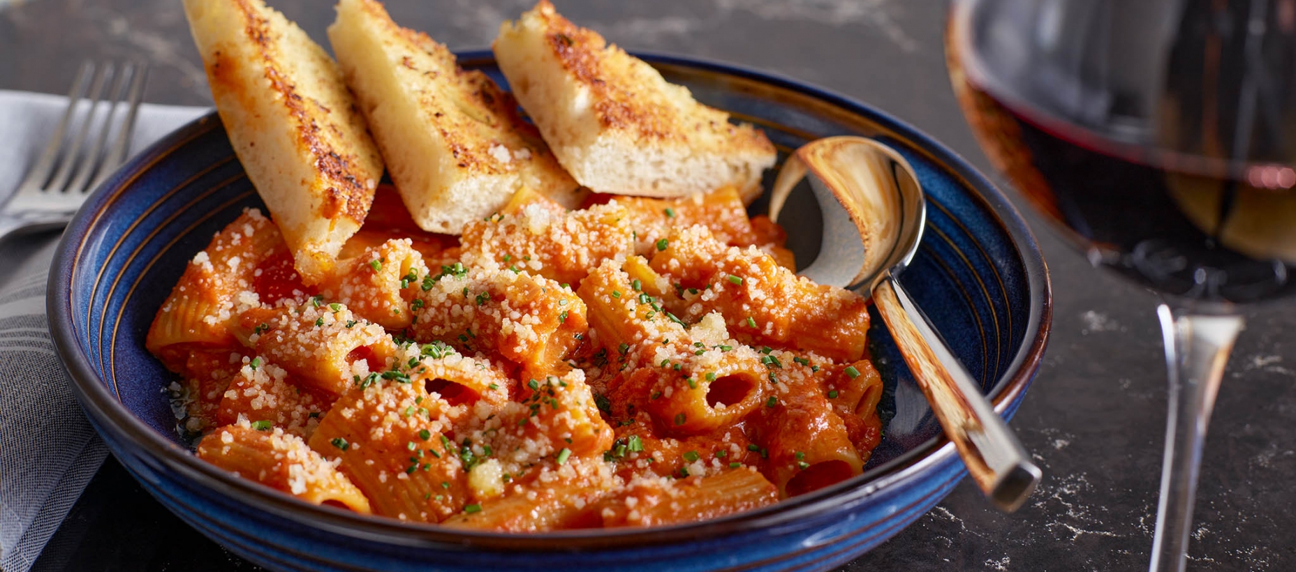 Bowl of Rigatoni and bread