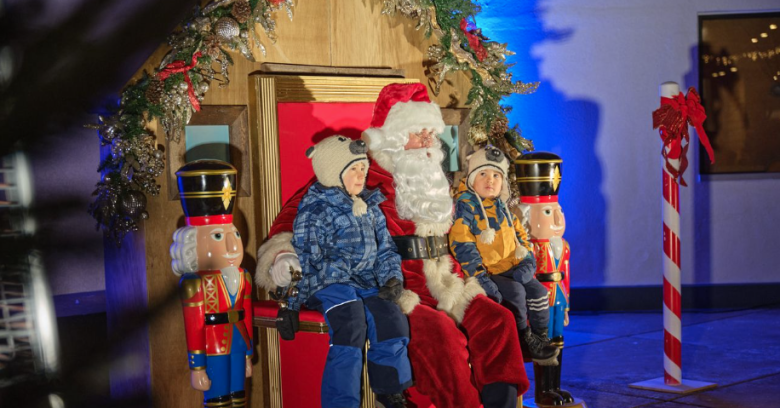 Kids sitting on santa's lap