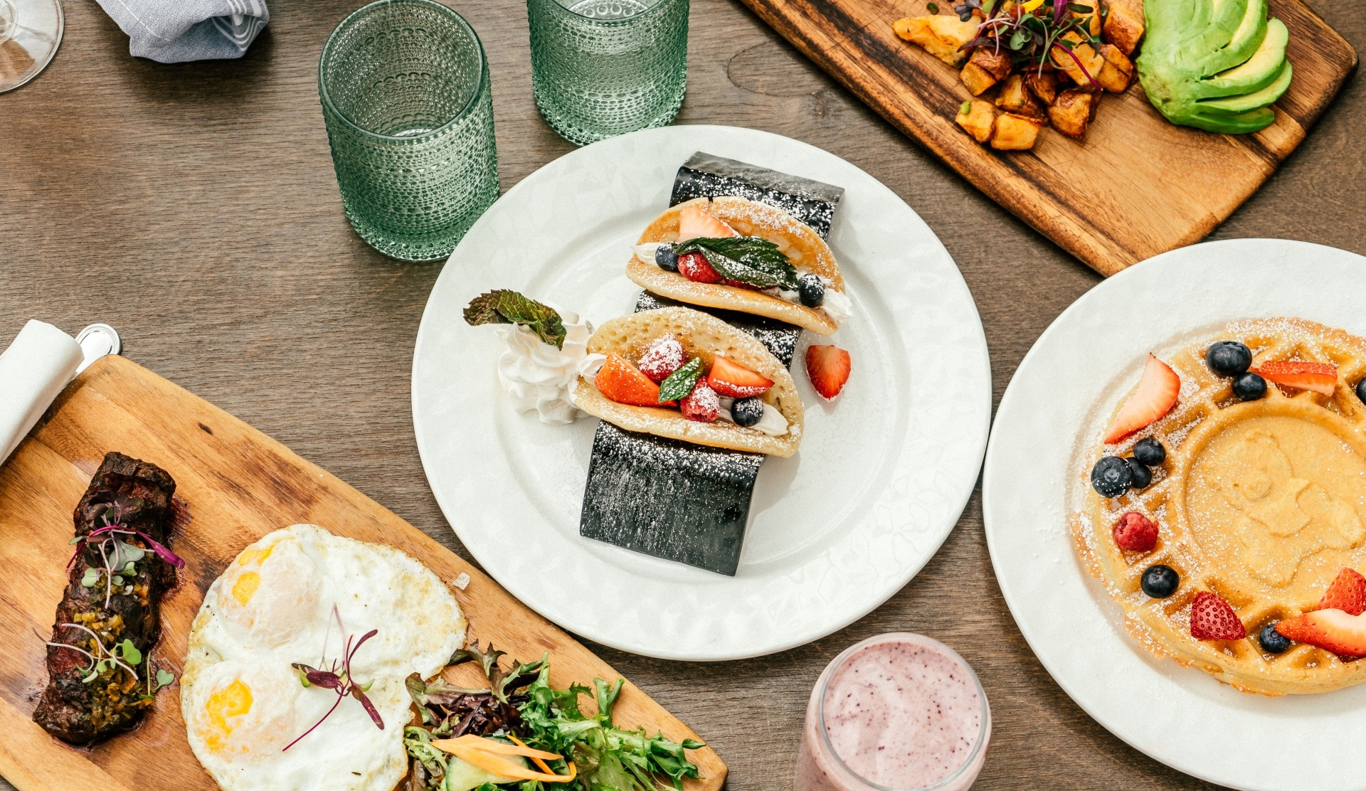 table of various brunch food items overhead shot